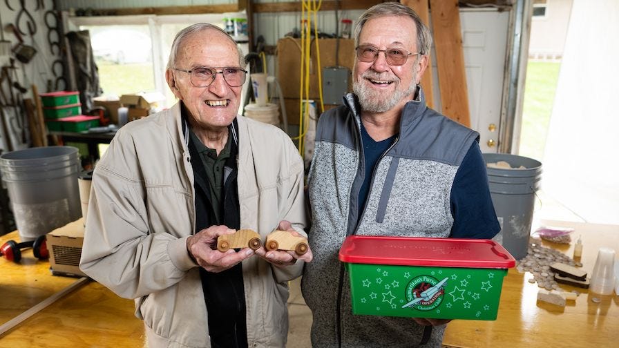 Ken and his father build wooden cars together